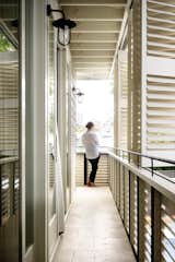 The loggia, or first floor covered balcony, is also a privacy screen that allows filtered air and light and obscures the neighbours’ view. The shutters were masterfully constructed by the builder and Shutters Australia. Shutters Australia
© Justin Alexander