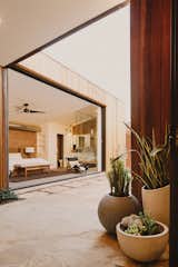 Breezeway to the master bedroom beyond that opens up to the pool courtyard through a pocketing glass door