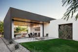 Concrete, Front Yard, Trees, Ceiling, Concrete, Back Yard, Grass, Exterior, and Stucco A board formed concrete fire pit draws you out to the back patio from the open living space  Exterior Stucco Trees Photos from Link House