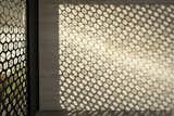 Afternoon shadows on the limestone from the custom pivot gate