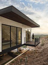 A modern take on the "Juliet Balcony" cantilevers over the mountain to provide an opportunity to step out and take in the Phoenix skyline at sunset