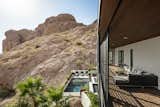 View from the new 2nd story deck down to the pool hugged by Camelback Mountain 