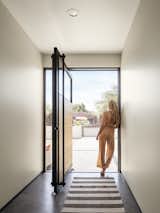 Custom entry pivot door, made from steel, glass and wood from the homeowner's lumber mill  Photo 5 of 23 in Weave by The Ranch Mine
