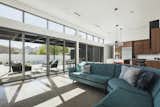 Aluminum clad, wood sliding doors and clerestory windows bring natural light into the great room