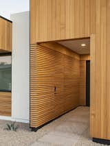 The recessed entry features a disguised door for guests