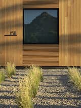 Exterior, Metal Roof Material, Gable RoofLine, House Building Type, and Wood Siding Material Detail view of the perfectly imperfect wood detail, inspired by the ribs of the Saguaro cactus  Search “The-Saguaro-Scottsdale.html” from Pleats