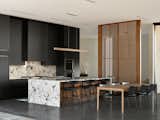 Walnut and black kitchen with date palm inspired wood screen