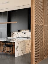Material details of the kitchen including the date palm inspired custom wood screen