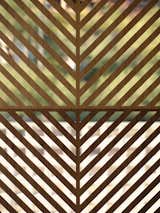 Detail of the date palm inspired custom wood screen