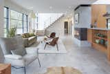 Living Room, Floor Lighting, Sofa, Bookcase, Table Lighting, Ceiling Lighting, Chair, Coffee Tables, Porcelain Tile Floor, End Tables, and Corner Fireplace  Photo 3 of 24 in Valle Vista House by Giulietti Schouten Weber Architects