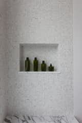 The perfectly dimensioned shower nook is a signature detail.
