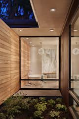 Bath Room, Concrete Floor, Freestanding Tub, Enclosed Shower, Pendant Lighting, and Stone Slab Wall Master Bath  Photo 9 of 12 in Union Bay Residence by DeForest Architects PLLC