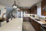 The space is anchored with a custom designed kitchen and island.