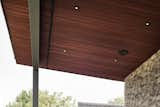 Soffit venting is integrated into the wood soffit.