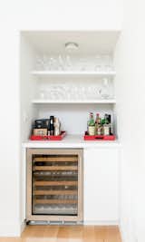 Hidden wine storage and a bar niche at the dining room allow for both function and the incorporation of color.