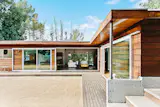 A wood deck wraps around the entire house.