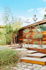 The residence is positioned at the curve of a cul-de-sac, slightly tucked back from the street.