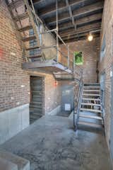 As part of the recycling effort, the stair ladder at upper left is an old fire escape ladder drug up from a beach house.  Conway Electric, LLC’s Saves from The Warehouse
