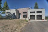 House is completely off-grid, notice solar array above the garage.  Photo 5 of 9 in The Warehouse by Copeland Architecture & Construction