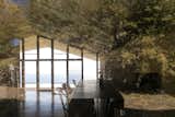 Bamboo reflections at the dining table, with the Pacific Ocean beyond.