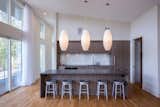 Kitchen, Laminate Cabinet, Engineered Quartz Counter, and Medium Hardwood Floor  Photos from Briar