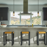 Fizz Pendant - Hand-blown clear bubble glass created by the local artisans at AO Glass is in the spotlight for this design. A spun brass collar surrounds the glass to give the pendant just a touch of an industrial feel. Your choice of finishes for the pipe and socket completes the look.

https://www.hubbardtonforge.com/products/187000