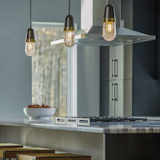 Fizz Pendant - Hand-blown clear bubble glass created by the local artisans at AO Glass is in the spotlight for this design. A spun brass collar surrounds the glass to give the pendant just a touch of an industrial feel. Your choice of finishes for the pipe and socket completes the look. 

https://www.hubbardtonforge.com/products/187000