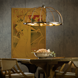 Arbor Chandelier - A latticework of steel sweeps down to finish in eight forged ends, each capped with a light. The arcs are joined together by a forged band that encircles the fixture. Victorian in inspiration, Hubbardton Forge in handcrafted quality. 

https://www.hubbardtonforge.com/products/104220