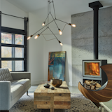 Divergence Pendant - Interconnecting pipes and rods of steel create a 3-D display of light. Different finish selections can be selected for the pipes and the rod accent pieces. Using frosted globe or Edison tube bulbs provide distinctly different looks, either contemporary or industrial, respectively. 

https://www.hubbardtonforge.com/products/138930