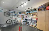 Streamlined shop space for projects and storage for Dean’s 5 bikes.