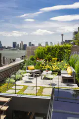 The rooftop utilizes reclaimed bluestone pavers and a majority of native plant species that require little water while insulating the environment below. 
