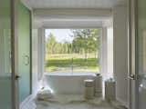 Master bathroom with Teton Mountain Range views in the distance.  Log stools repurposed from renovation.