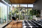 Guest room sliders open up 2 walls to the outside with glass louvers 