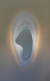 Viscosity by Rob Zinn for blankblank

Part of the Helicentric Collection by Rob Zinn, Viscosity is a uniquely shaped layered wall or ceiling sconce light. Colors applied to the back of each satin white layer glow subtly in natural light when the fixture is off but glow brightly when turned on. Available in 4 sizes, multiple colorways and mono colors and custom color combinations.  For hardwiring, dimmer recommended.  UL Listed with Edison base or GU-24 pin base. Optional LED light source.

Shown in Aether.

Leadtime 8 weeks. Made in Northern California.

http://blankblank.net/designs/viscosity/