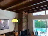 Living room showcasing exposed beam ceiling