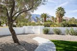 To save water, much of the yard has been filled in with desert pebbles.