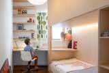 Kids Room, Bedroom Room Type, Desk, Bed, Bunks, and Shelves There is a small access point between the window and bed structure  Photo 6 of 8 in Two-In-One-Kids-Room by Sali Tabacchi Inc.