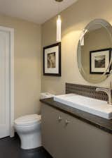 Remodeled powder room is clean, modern and compact.  