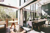 The living space continues out onto the deck, flooded also with natural light and a great view.