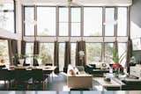 The living space, full of sunshine breezes and a great view with a double hight ceiling. The thermal mass floor catches the winter sun.