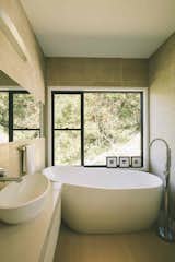 Naturally lit bathroom with a view