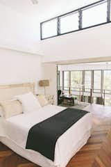 The main bedroom takes advantage of the beautiful views out over the void in the living space.