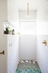 the walk-in shower with continuous ledge carved into wall
