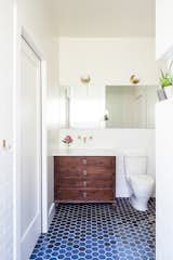 floor tiles continue back into the rest of the bathroom