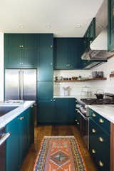 wall of tall storage cabinets with a recessed shaker panel