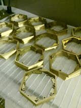 65 hexagonal plates for the Solas Table Lamp are assembled by hand in Colorado Springs.  Photo 19 of 22 in Peek Behind the Scenes of Luxury Lighting Manufacturer Boyd Lighting by Boyd Lighting