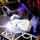 A highly skilled craftsman creates seamless welding on the Circolo Sconce; this superior quality is what Boyd Lighting is known for.