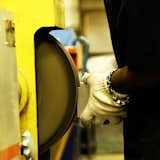 Each piece of metal is hand polished by a skilled craftsperson in the Boyd Lighting factory in Colorado Springs.