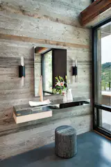 In this foyer by JamesThomas is a pair of Halfpipe Sconces designed by Michael Wolk for Boyd Lighting. Available in either gold or white gold leaf, this #LED and #ADA sconce is energy efficient and very stunning. Interior design by JamesThomas. #Boydlighting #lighting #sconce #industrialsconce