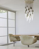 The Icicle Disk features clear or etched glass "icicles" that hang from cloth covered cord that comes in a variety of colors. It is energy efficient with LED lamps that can be dimmed. #lighting #ceilingfixture #conferenceroom #office #commercial